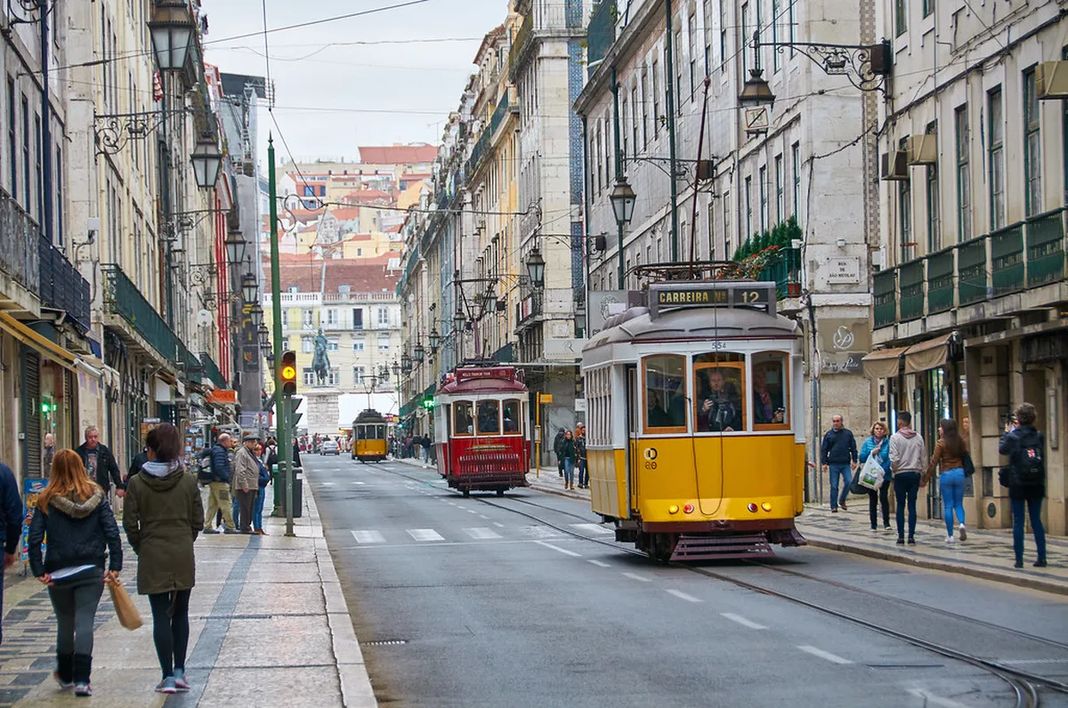 Riding a historic yellow Lisbon tram