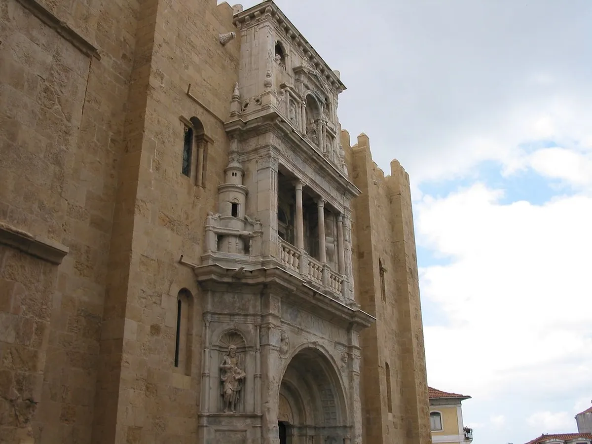 Coimbra Sé Velha Old Cathedral rising above the medieval old town rooftops