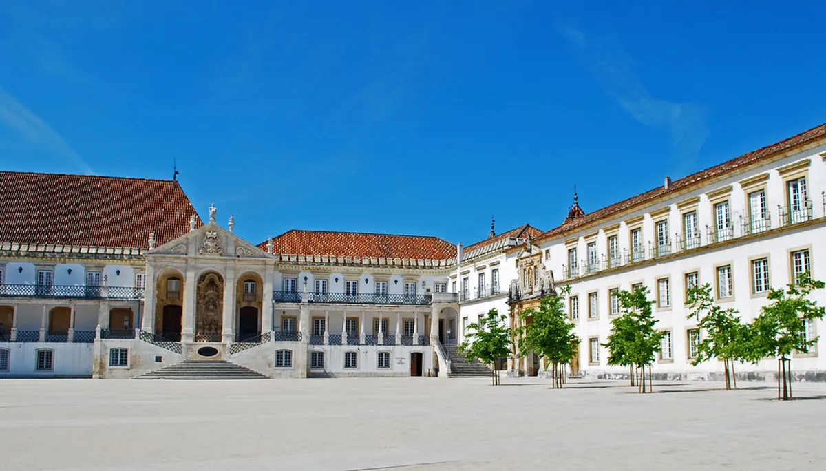 Coimbra University campus overlooking the city under an autumn sky with golden light