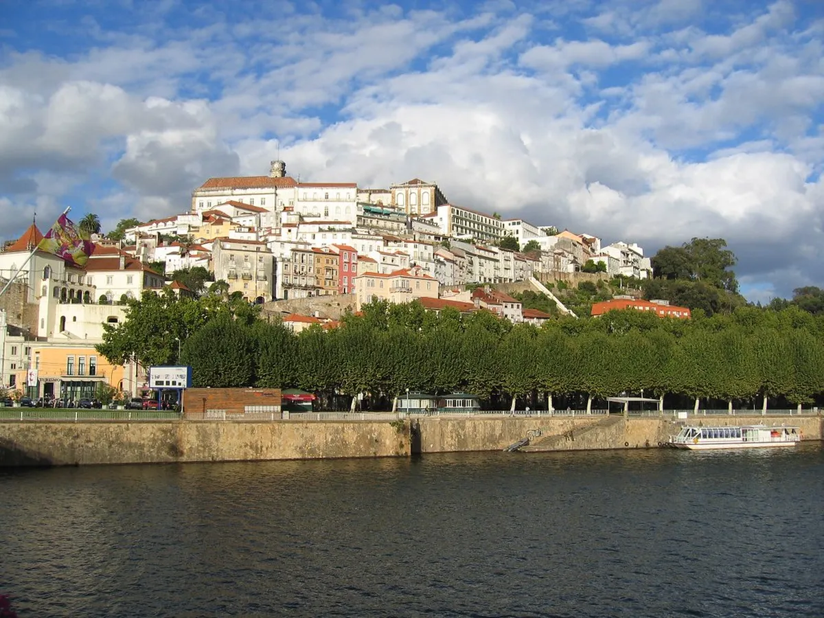 Coimbra old town narrow cobblestone streets lined with traditional Portuguese buildings and university quarter