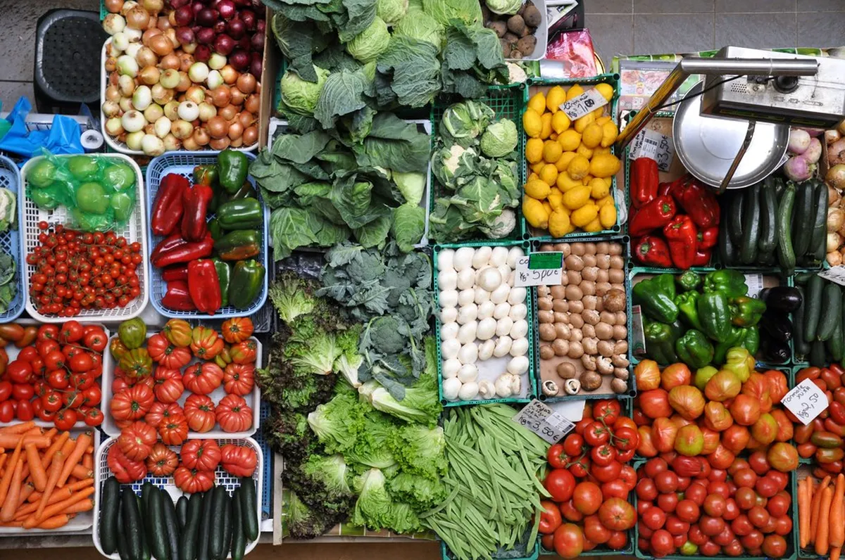 Vibrant Coimbra market stalls displaying fresh local produce and artisan goods in the historic city centre