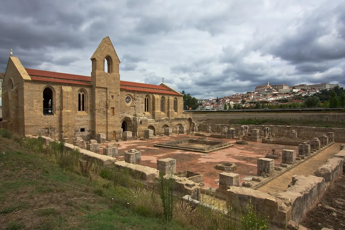 Coimbra Santa Clara monastery reflected on the Mondego River, a landmark tied to the city's medieval heritage