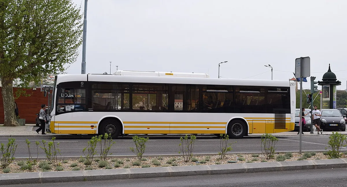 A Coimbra SMTUC bus navigating the narrow cobblestone streets of the city's historic centre