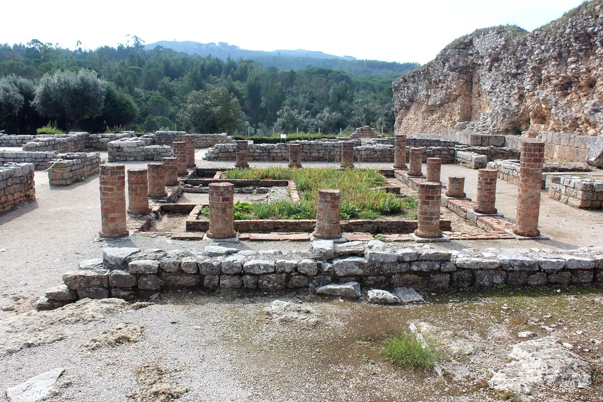 Well-preserved Roman mosaic floors and stone walls at the ancient Conimbriga ruins near Coimbra, Portugal