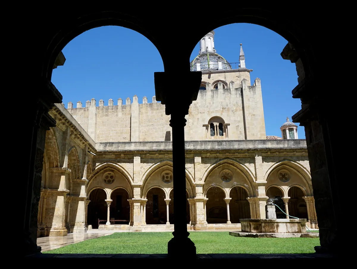 Sé Velha Coimbra cathedral and cloister viewed from the historic courtyard in Coimbra, Portugal