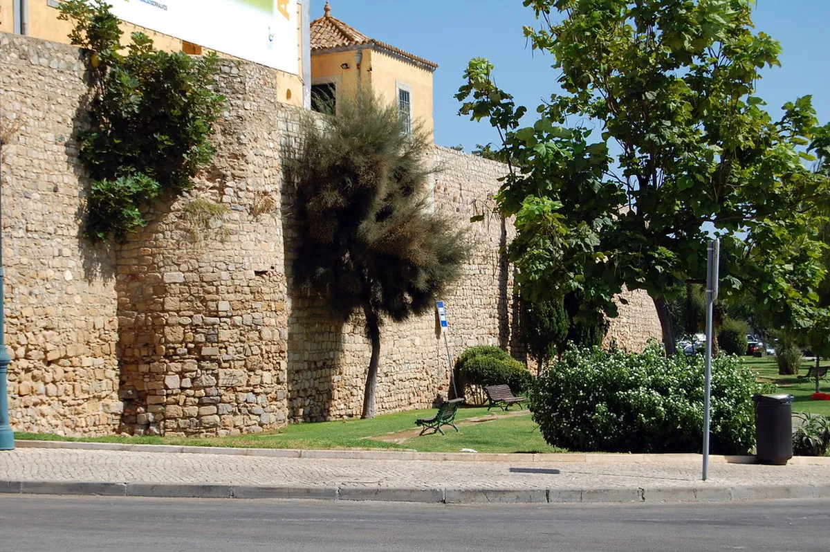 Ancient Faro city walls ramparts with views over the rooftops and Ria Formosa natural park beyond