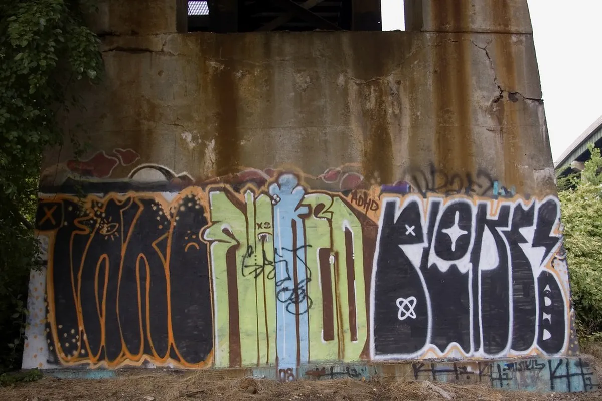 Colorful street art mural on a historic building wall in Faro, Portugal
