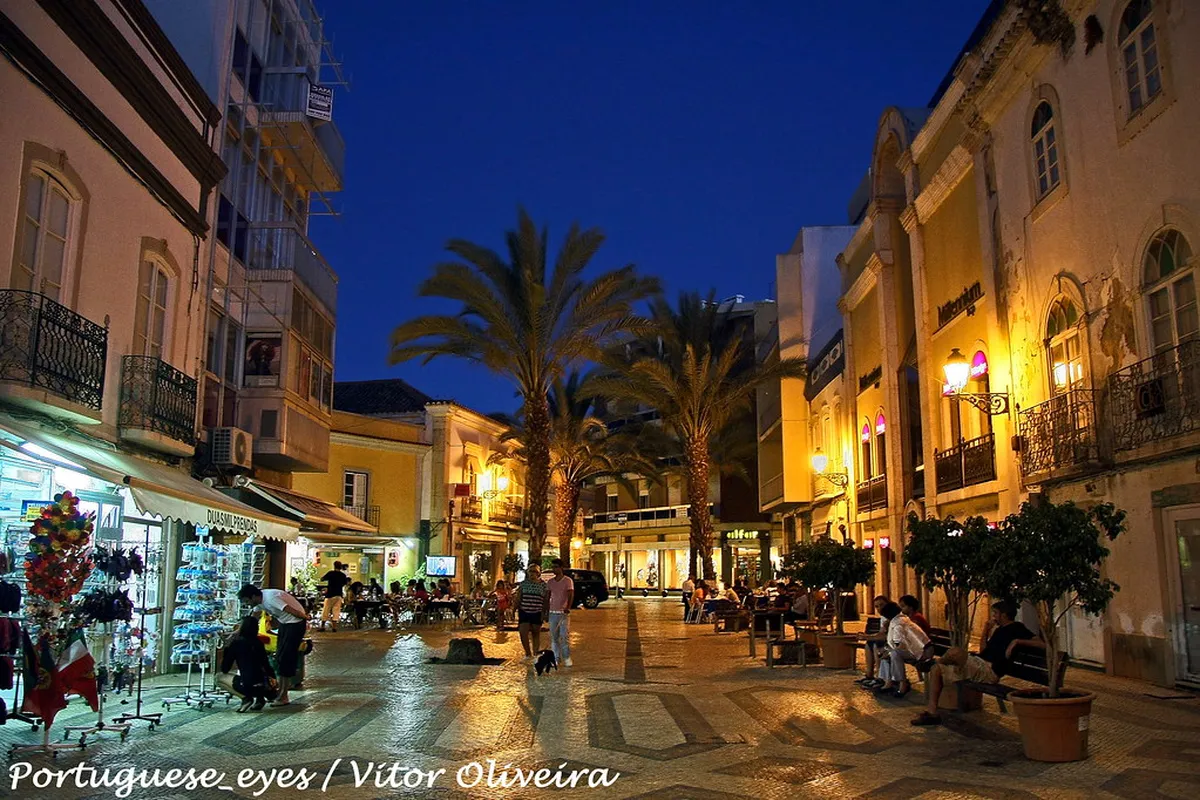 Faro city streetscape with traditional Portuguese buildings and historic architecture in the Algarve