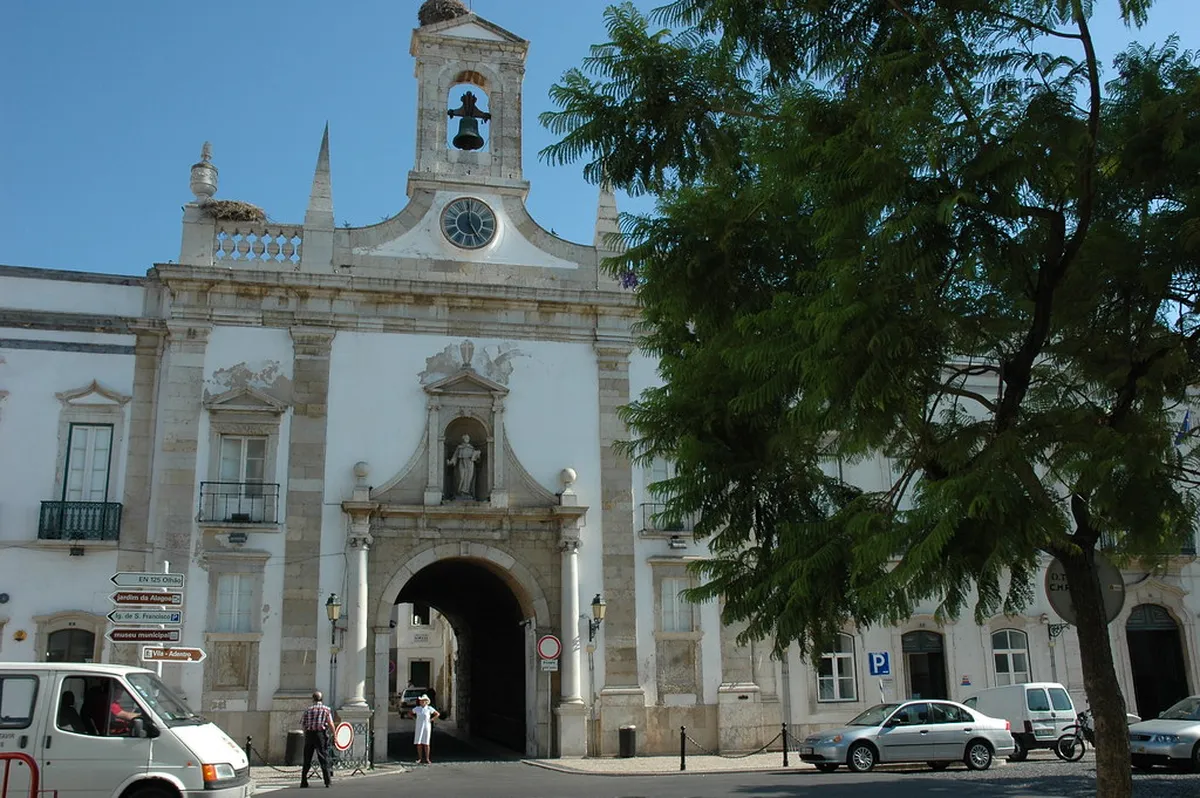 Arco da Vila neoclassical arch gateway leading into Faro's walled Cidade Velha historic district