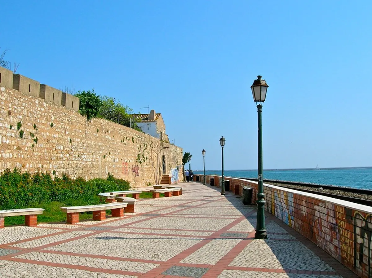 Ancient Faro city walls stretching through the Cidade Velha revealing centuries of Roman and Moorish fortification history