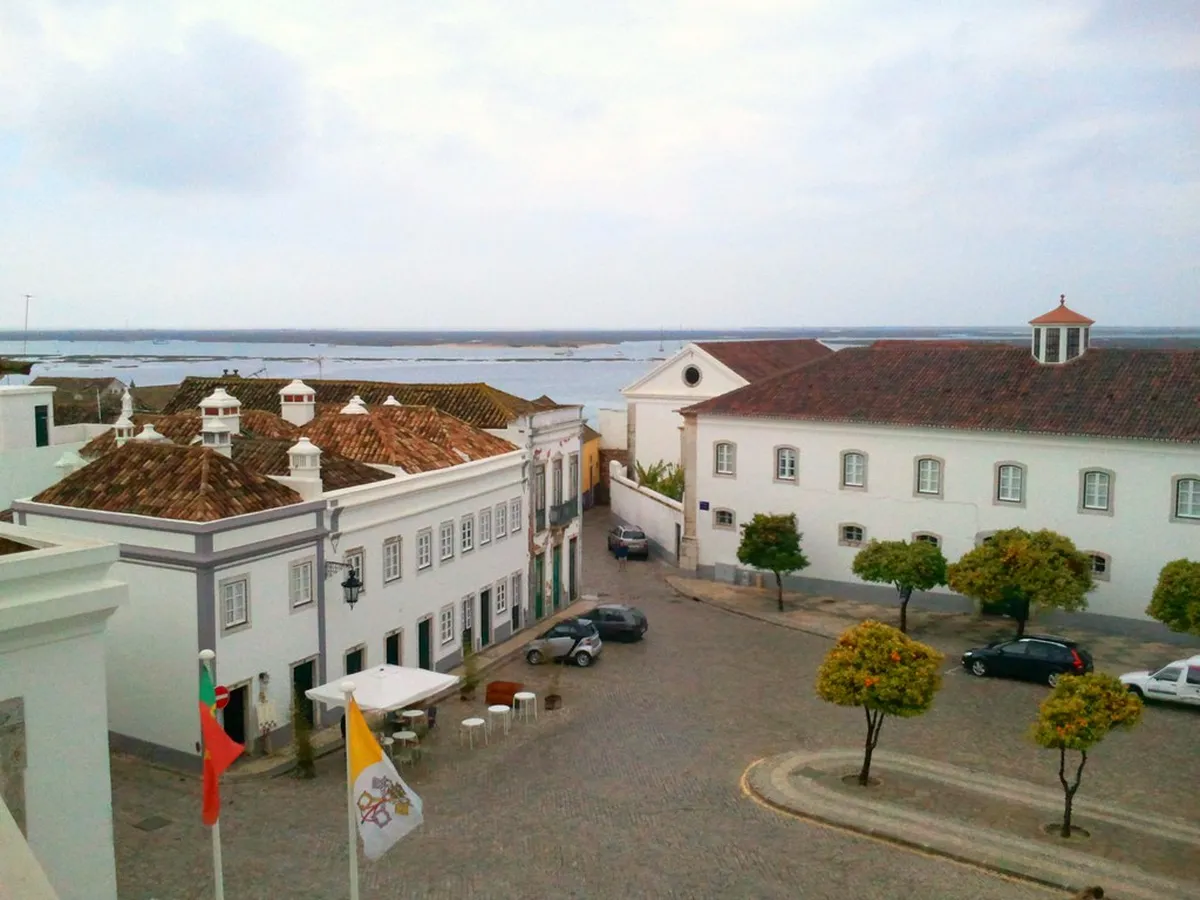 Faro Cathedral and surrounding Cidade Velha rooftops viewed from the ramparts inside the historic walled district
