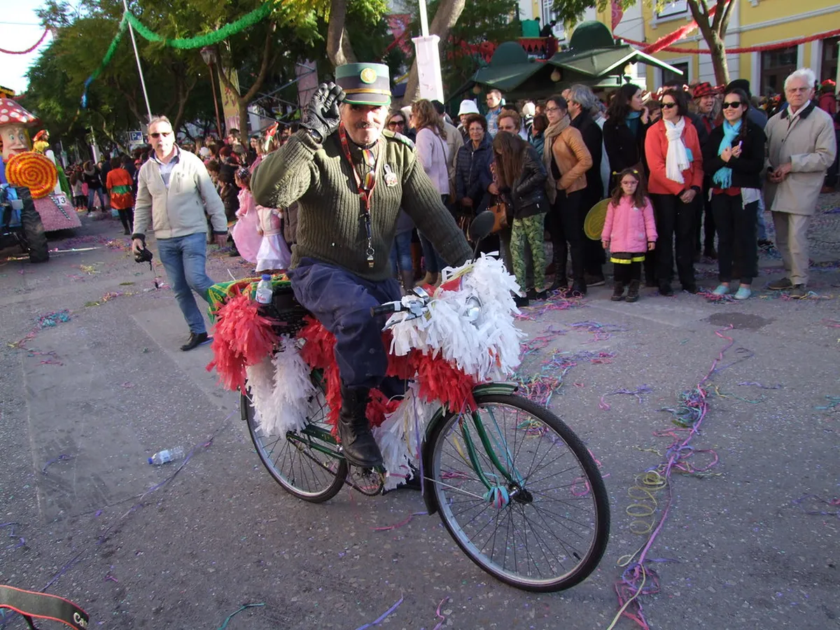 Colorful Faro Carnival parade in the Algarve with costumed revellers celebrating in the streets