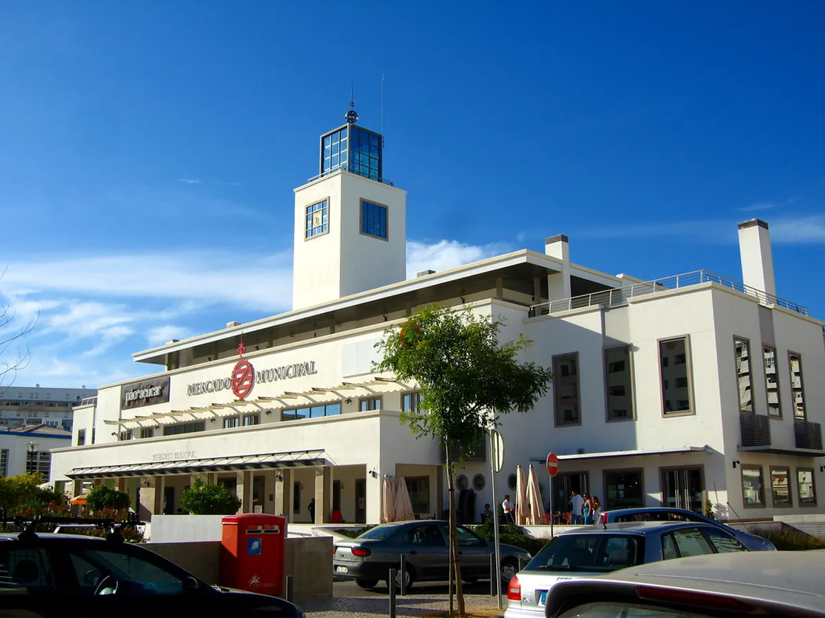 Faro Mercado Municipal building entrance with local shoppers in the Algarve