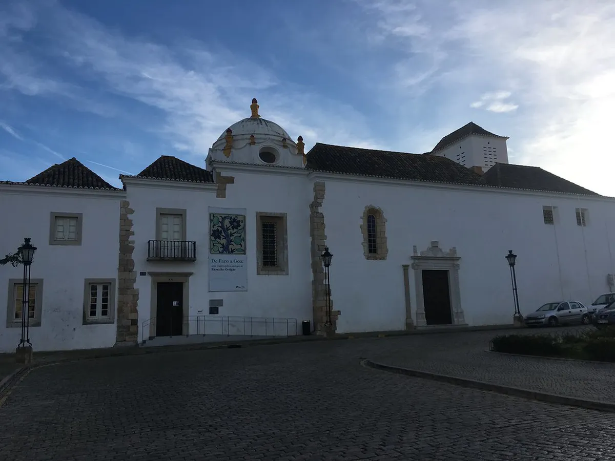 Faro Cathedral tower and Old Town rooftops in Faro, Portugal