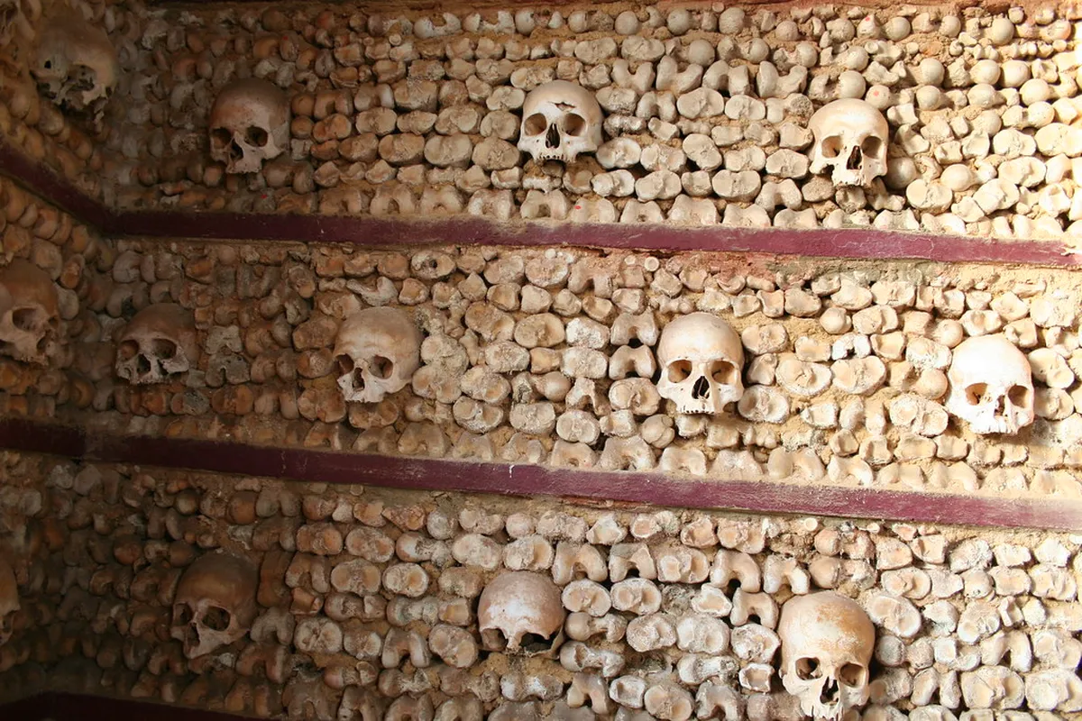 Interior of the Bone Chapel in Faro adorned with human bones, a haunting yet historic attraction in the Algarve