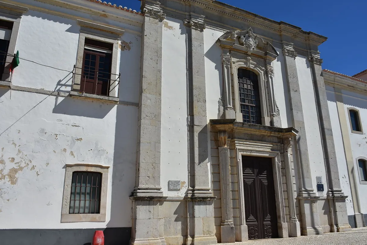 Baroque facade of Igreja de São Francisco with ornate stonework detail in Faro, Portugal