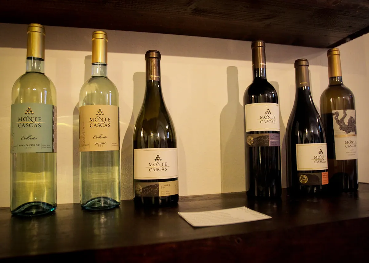 Faro gourmet food stall offering local Algarve delicacies including fig sweets, olive oil, and regional specialties