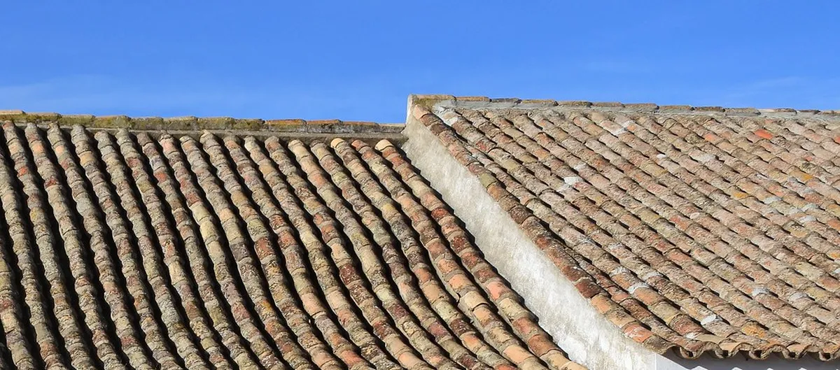 Traditional terracotta roof tiles of Faro old town viewed from the ancient city walls