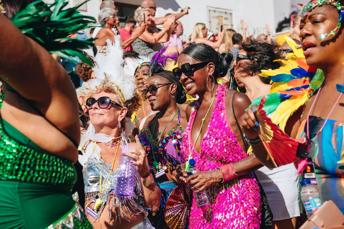 Faro street celebration with colourful decorations and locals gathering for a seasonal festival in the city centre