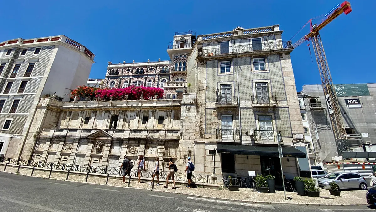 Moorish Cerca Moura walls integrated into the Alfama hillside neighbourhood of Lisbon