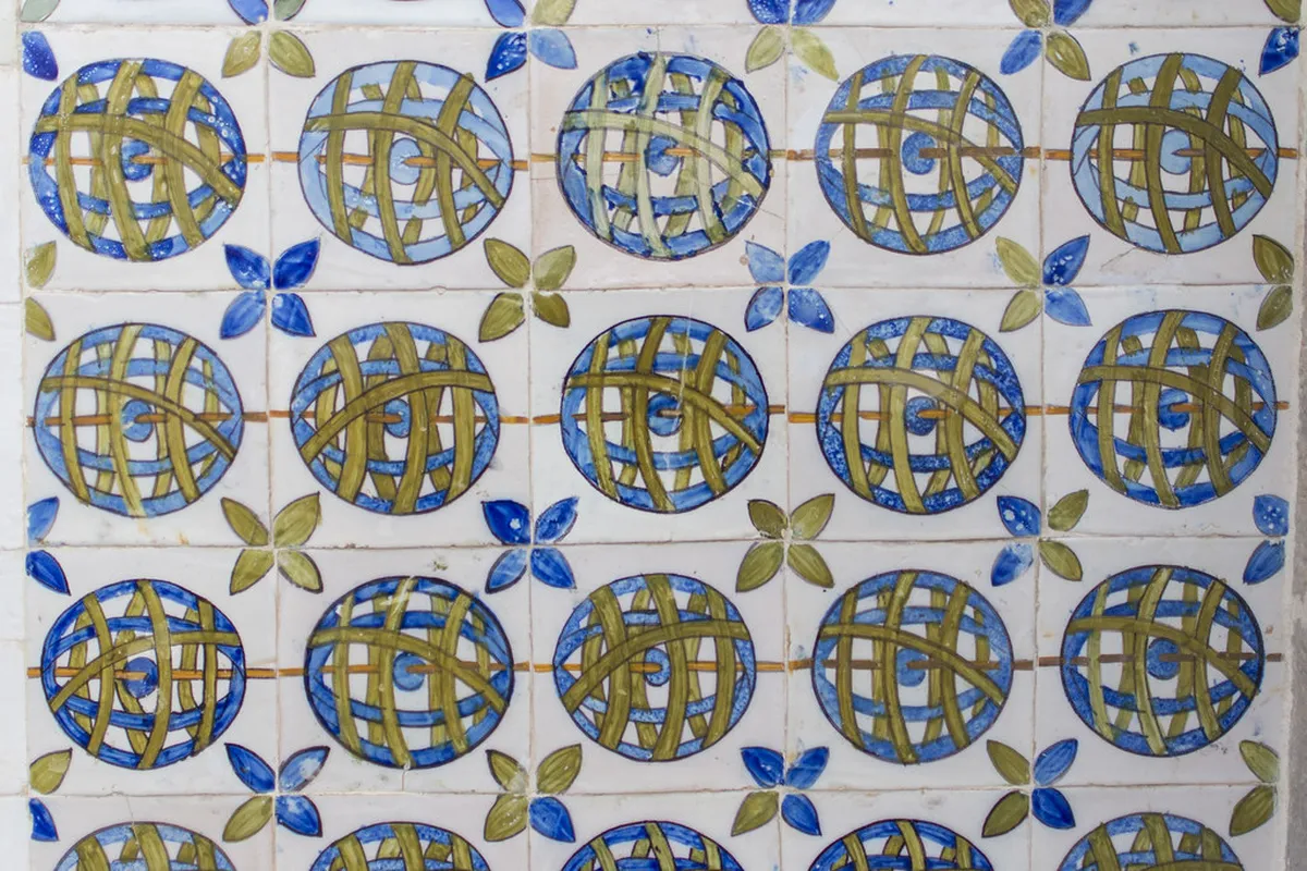 Hand-painted azulejo ceramic tiles in a Lisbon art class showcasing traditional Portuguese tile painting