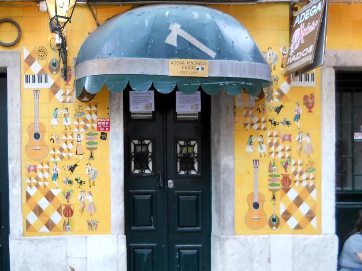 Bairro Alto fado house interior with musicians performing in Lisbon's bohemian nightlife district