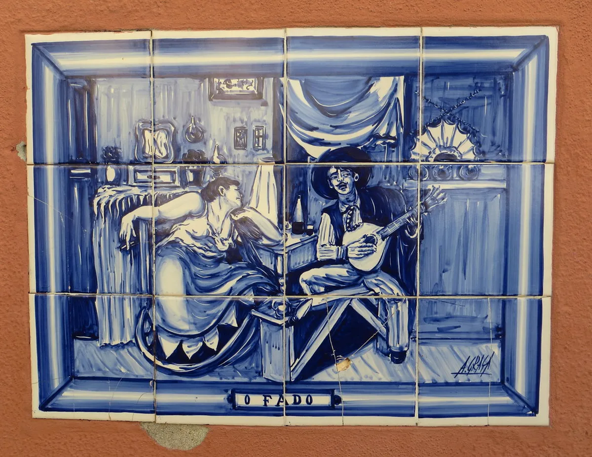 Traditional Fado performance in Lisbon with a singer and Portuguese guitar musicians in an intimate venue