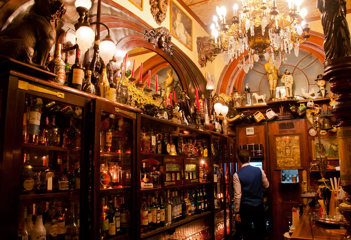 Lisbon's Pavilhão Chinês bar interior lined with antique collectibles, porcelain, and eclectic decor