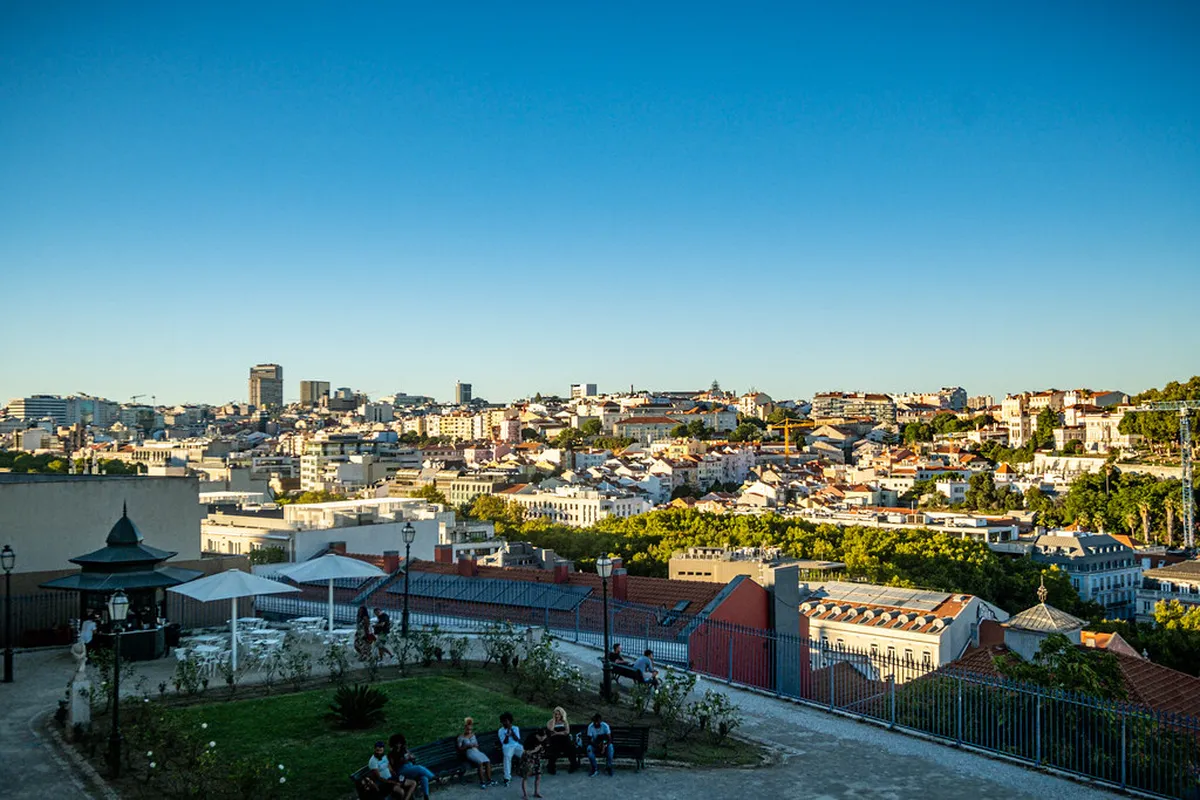 Panoramic view from Miradouro de São Pedro de Alcântara in Lisbon with the castle and rooftops below