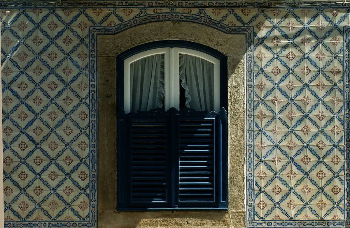 Charming Campo de Ourique neighbourhood in Lisbon with colourful tiled buildings and a quiet street