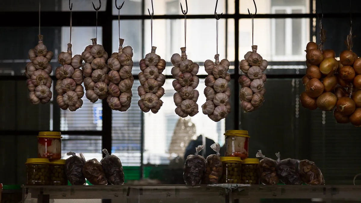 Lisbon's Mercado de Arroios interior with colourful market stalls selling fresh produce and local goods