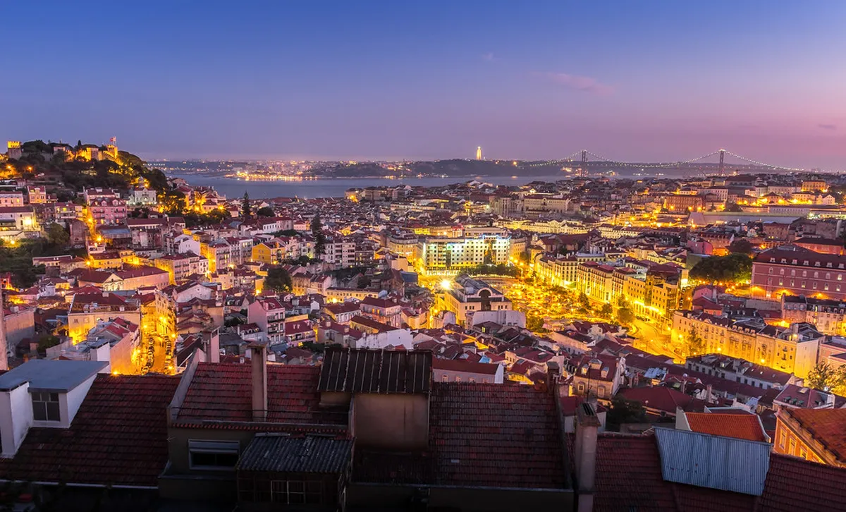 Panoramic Lisbon cityscape from Miradouro da Senhora do Monte, the highest viewpoint in the Graça neighborhood