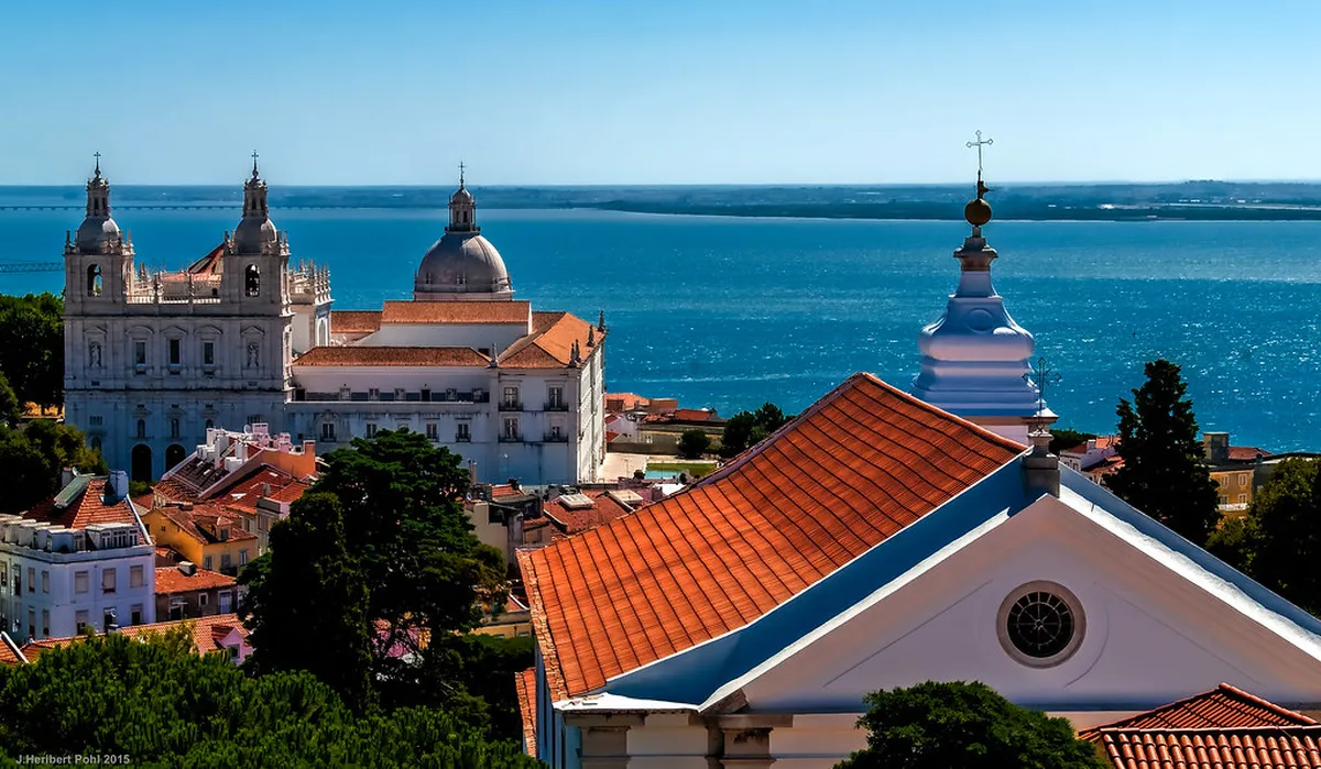 Lisbon Baixa Chiado elegant streets with historic architecture and busy pavement cafes