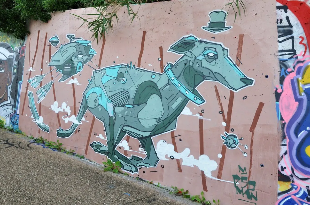 Large-scale Lisbon mural on a building wall in the Graça neighborhood depicting local cultural identity