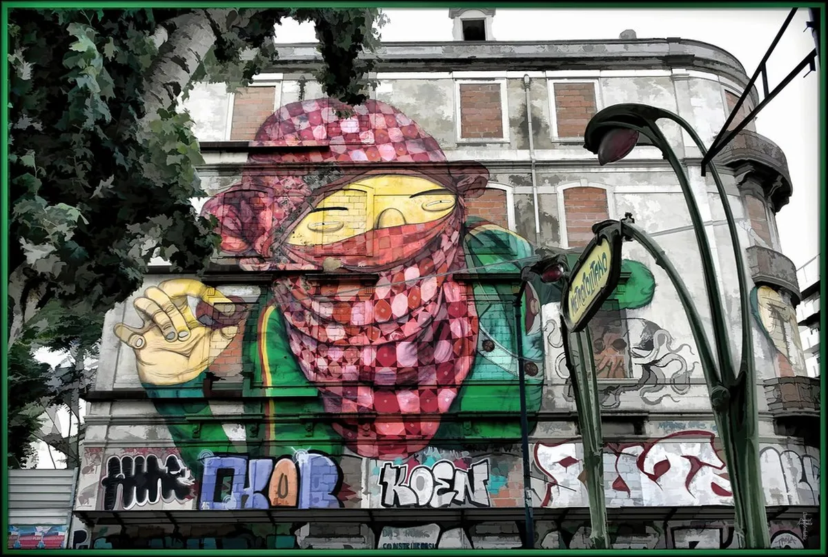 Colorful Lisbon street art mural covering an entire building facade with bold figures and vivid hues