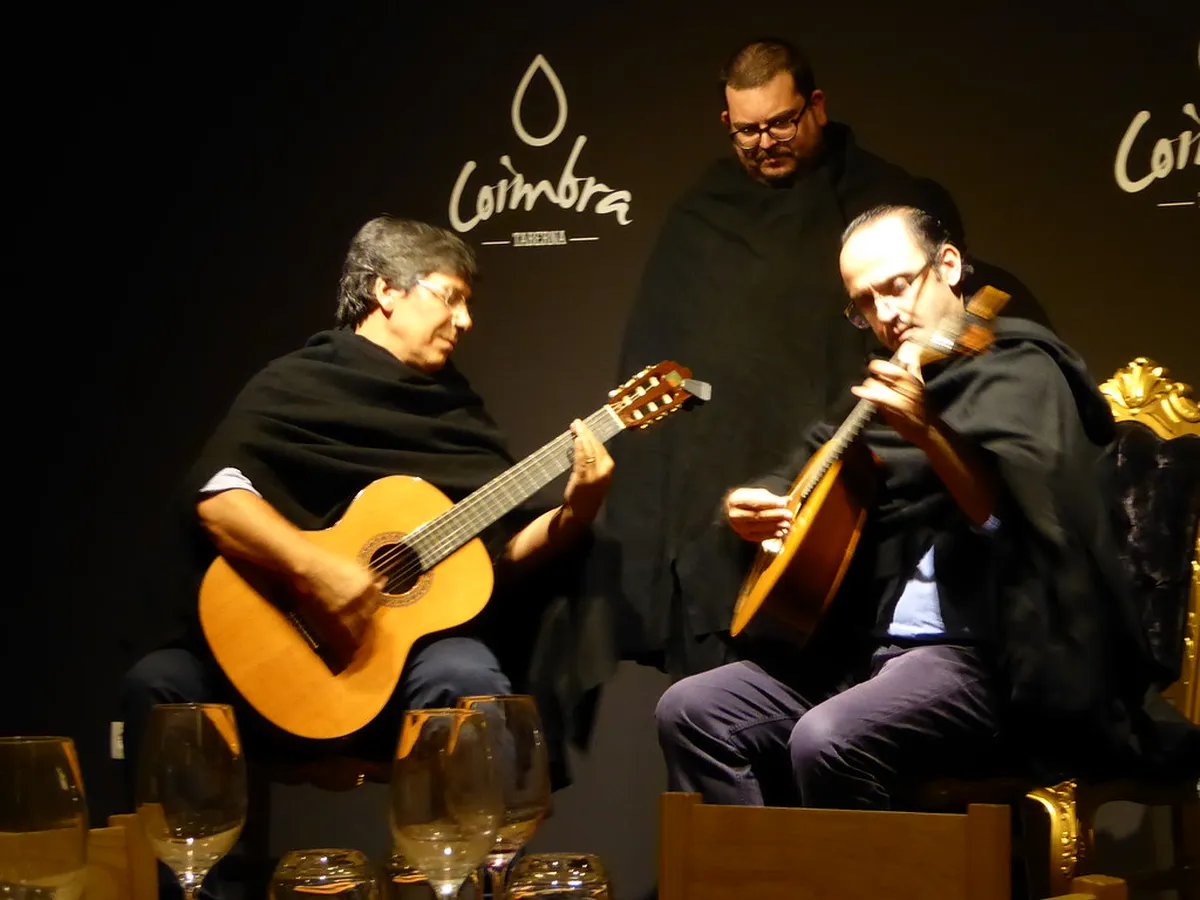 Intimate Lisbon fado music performance with guitarist and singer in a candlelit venue