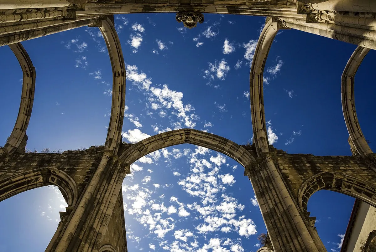 Weathered stone walls and ruins in Lisbon reflecting the enduring legacy of the 1755 earthquake