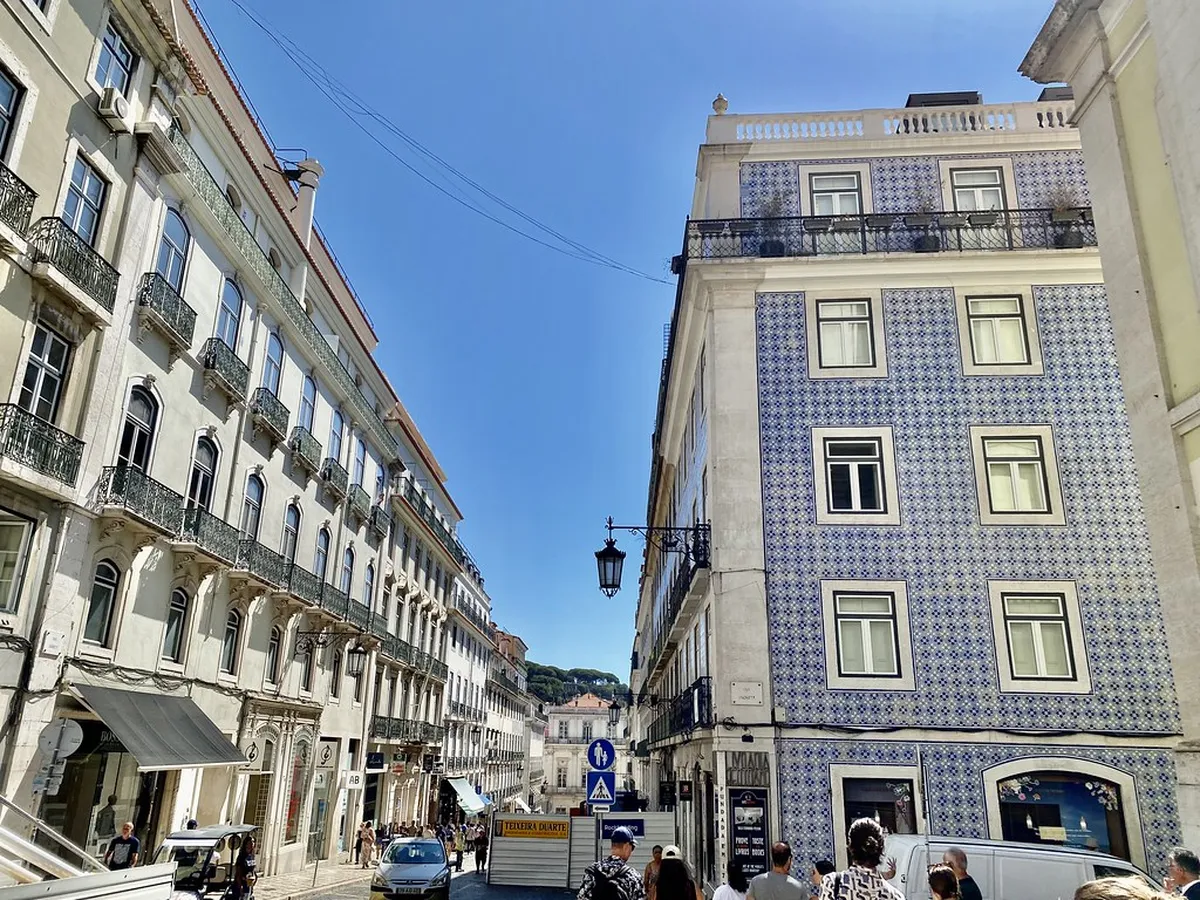 Elegant Lisbon Chiado street lined with upscale fashion boutiques and grand 19th-century facades
