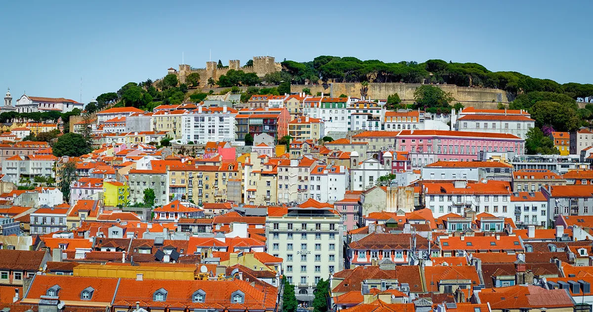 The Lisbon Santa Justa lift rising above the Baixa rooftops with its ornate wrought-iron Neo-Gothic ironwork