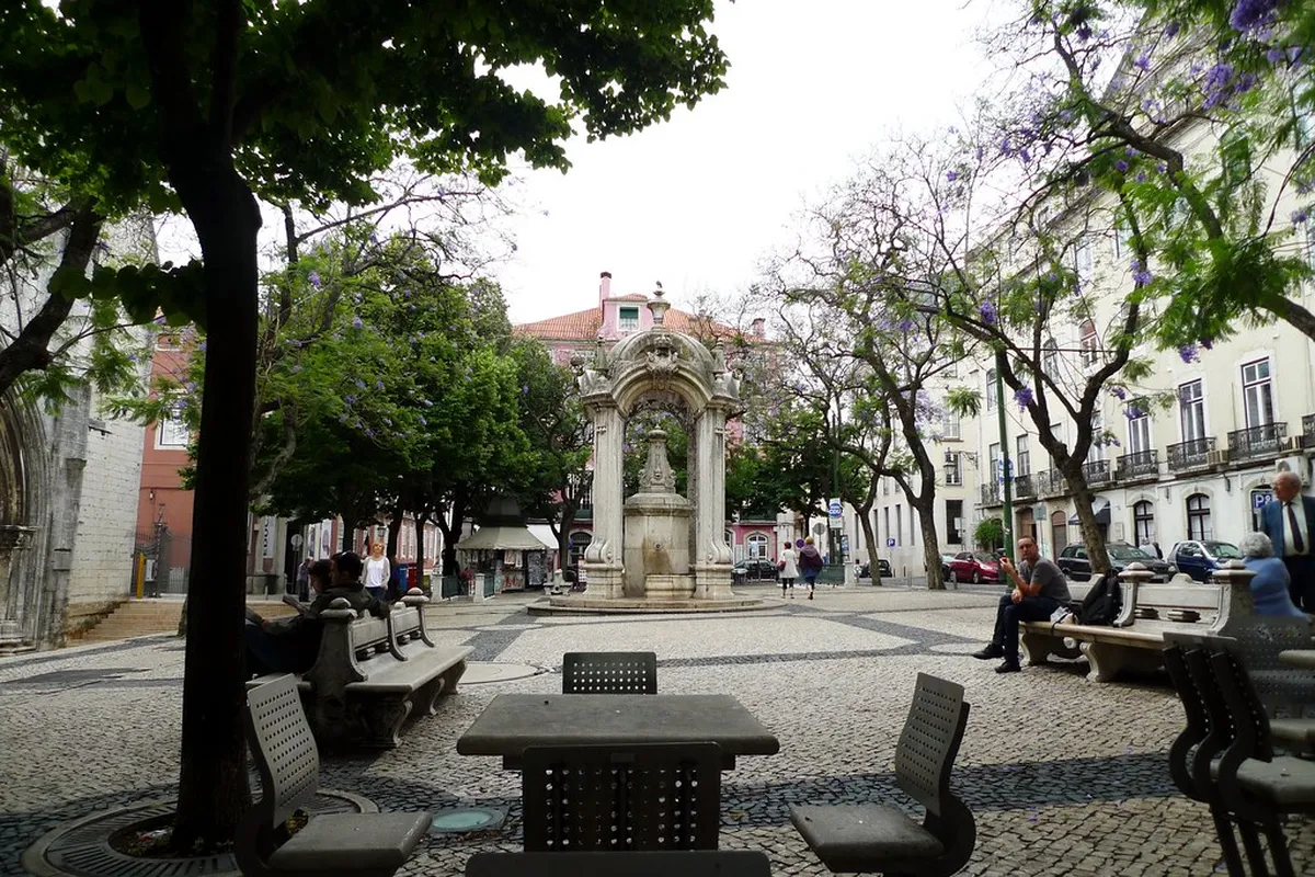 Largo do Carmo square in Lisbon with the Gothic arches of the Carmo Convent ruins in the background