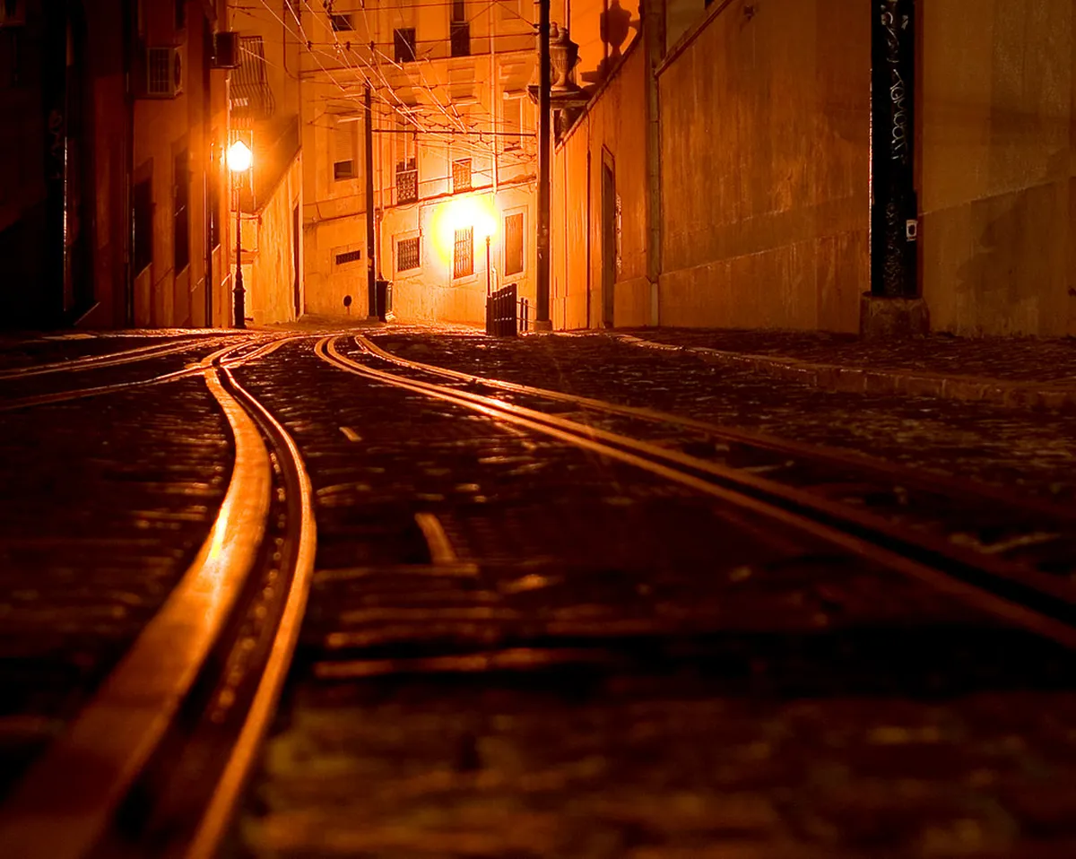 Intimate candlelit fado house in Bairro Alto, Lisbon, where guests enjoy authentic fado dinner shows
