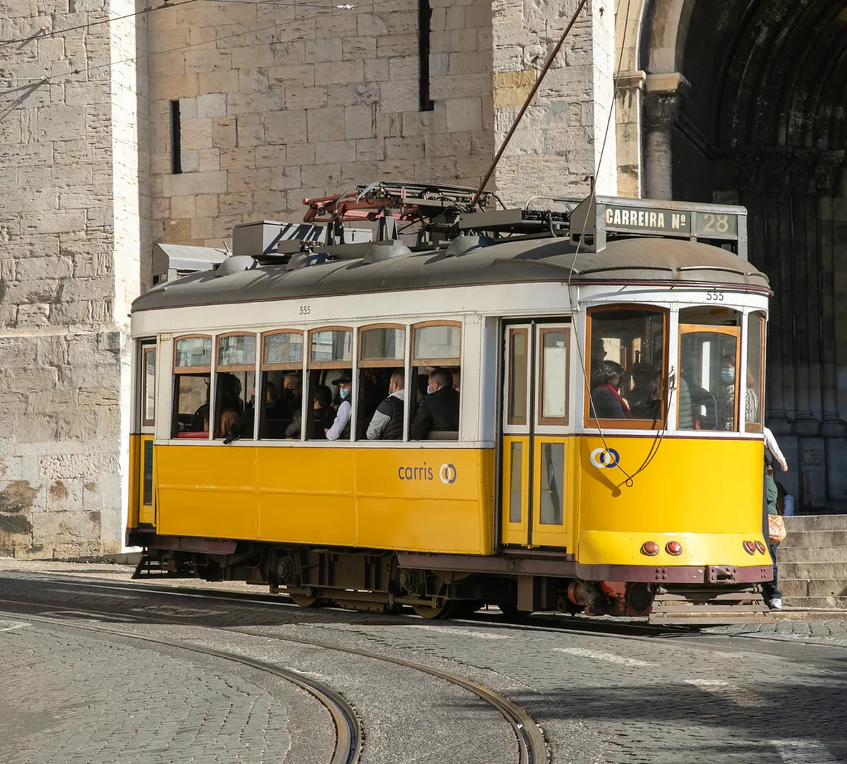 Colorful street scene in Lisbon's Mouraria district with traditional architecture and vibrant cultural atmosphere