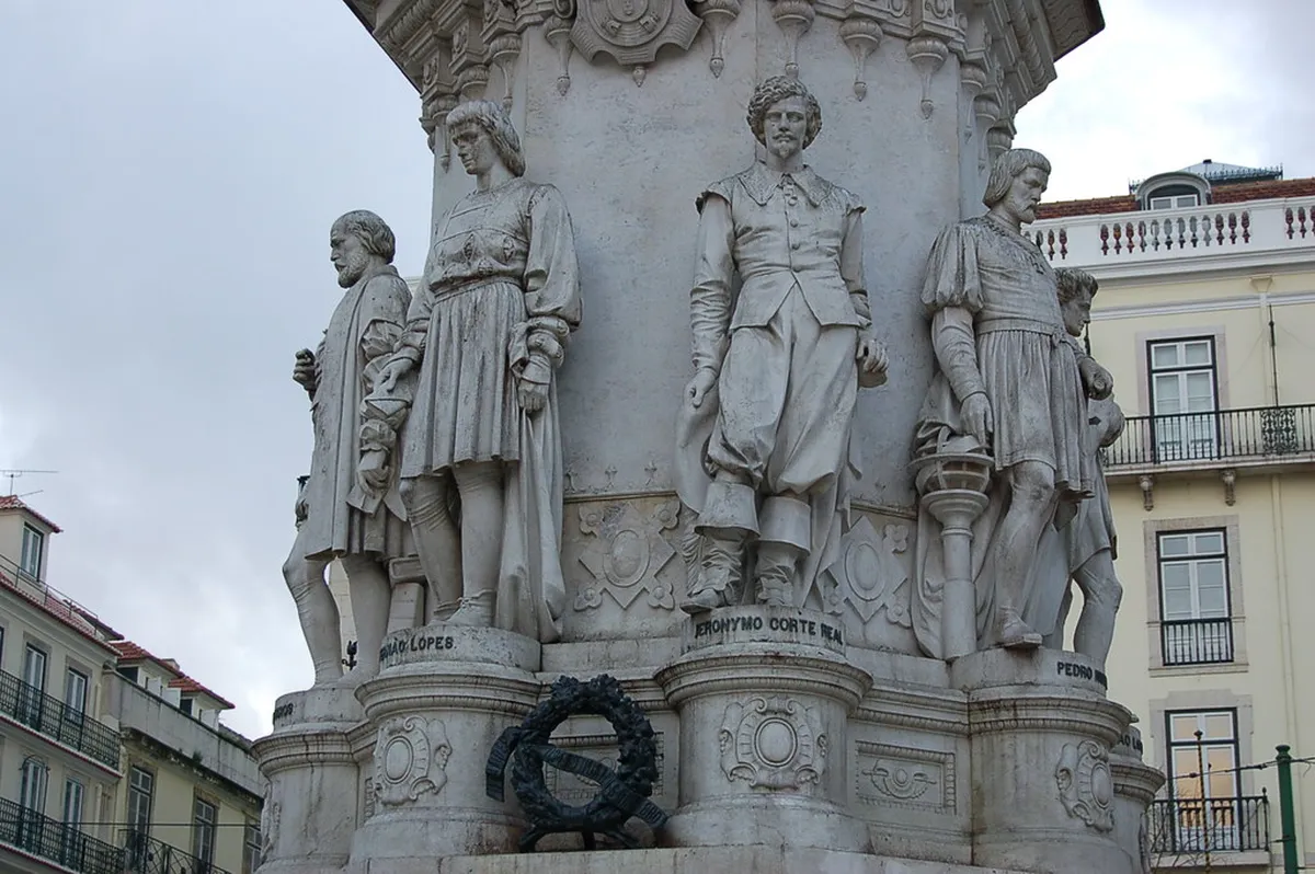 Luís de Camões statue in the lively Chiado square in central Lisbon surrounded by the historic neighbourhood