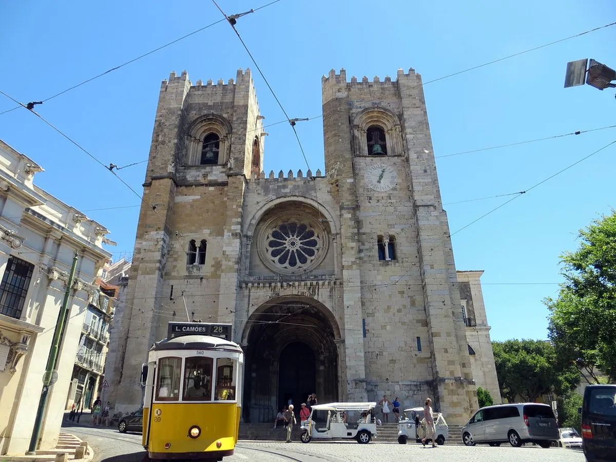Lisbon Cathedral Sé de Lisboa with its Romanesque towers rising above the historic Alfama neighbourhood