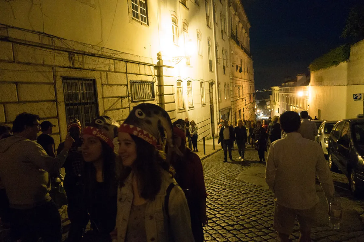 Colorful Lisbon street decorated with festive bunting and lanterns during the Santos Populares summer celebrations