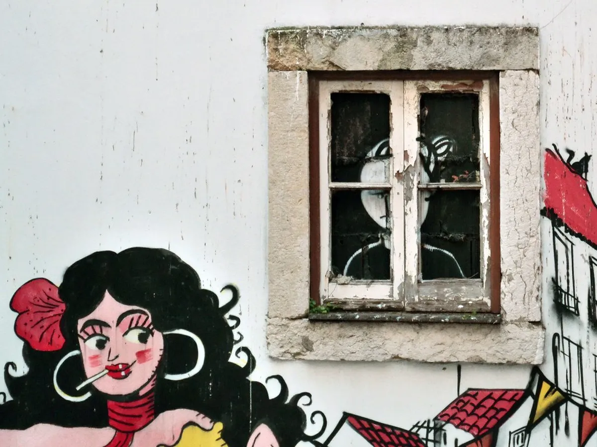 Mouraria neighborhood in Lisbon where Fado music was born, narrow historic streets lined with traditional buildings
