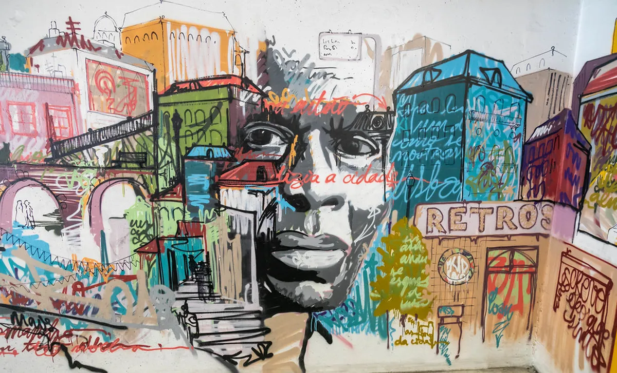 Colorful street art mural on a building wall in Lisbon celebrating local culture and neighborhood identity