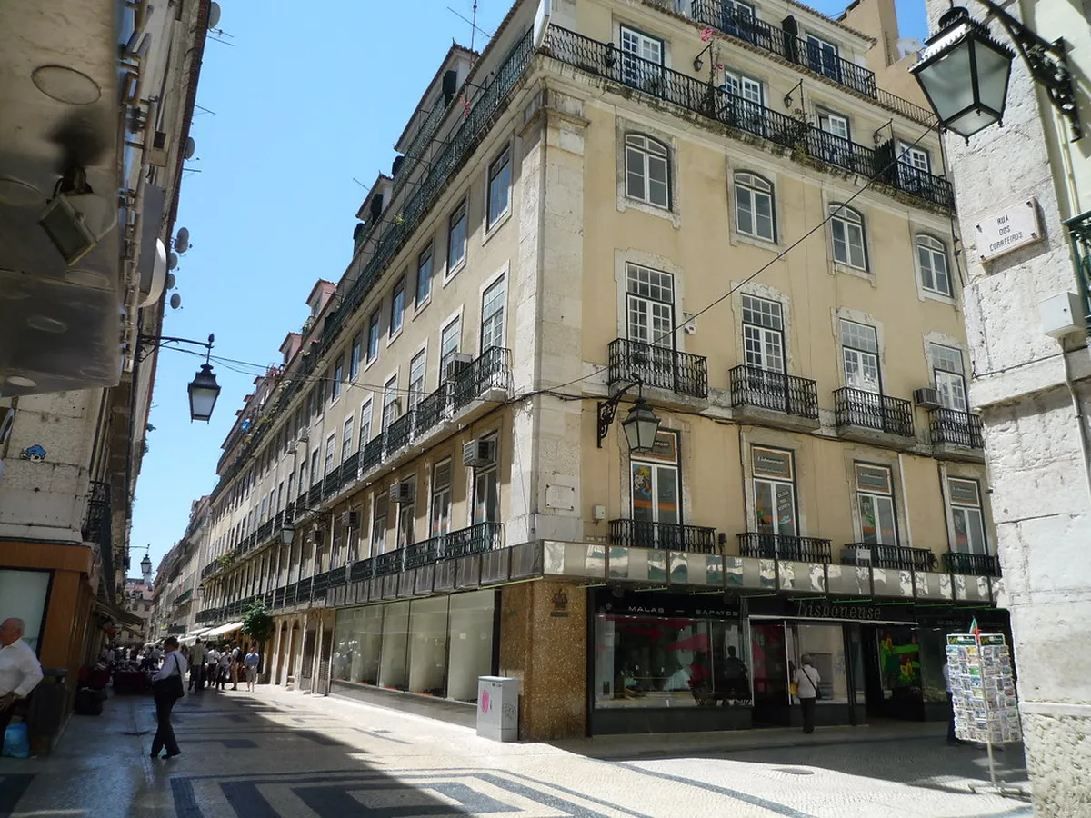 Lisbon's Baixa district with wide pedestrian streets where taxis and ride-shares drop off visitors
