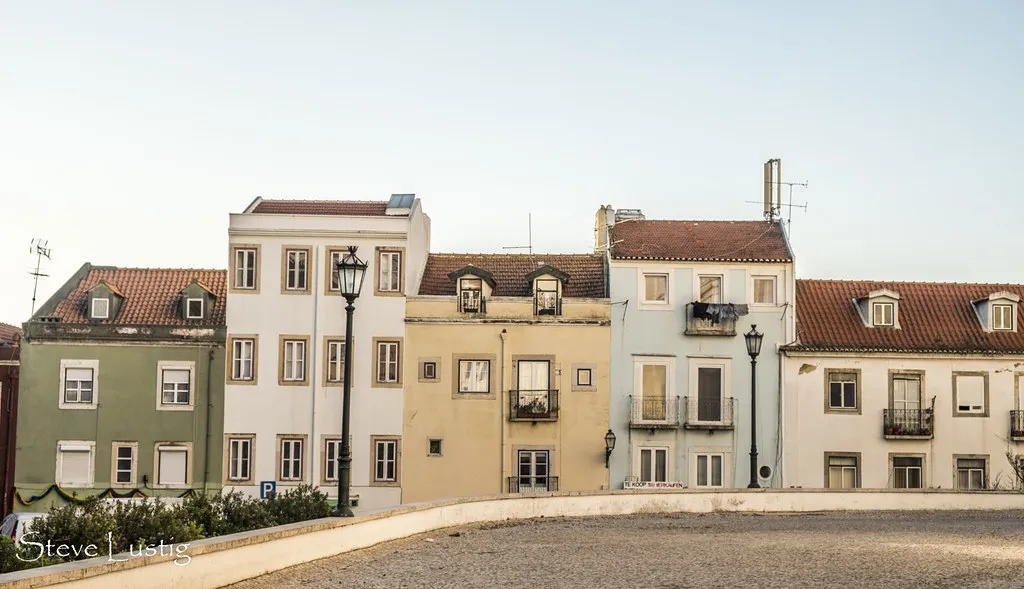 Colourful traditional buildings lining the narrow streets of Lisbon's Alfama neighbourhood near the tram stops