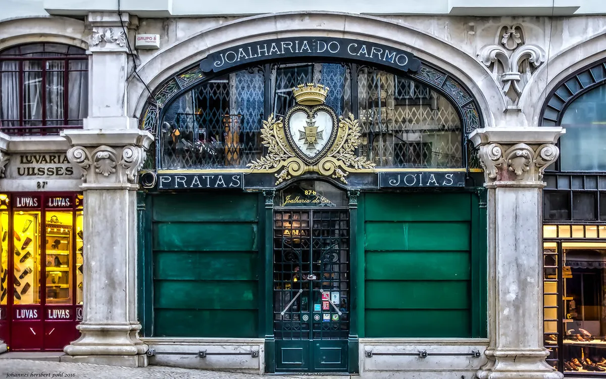 Colorful Lisbon Alfama and Mouraria neighborhood streets lined with tiled facades and traditional Portuguese architecture